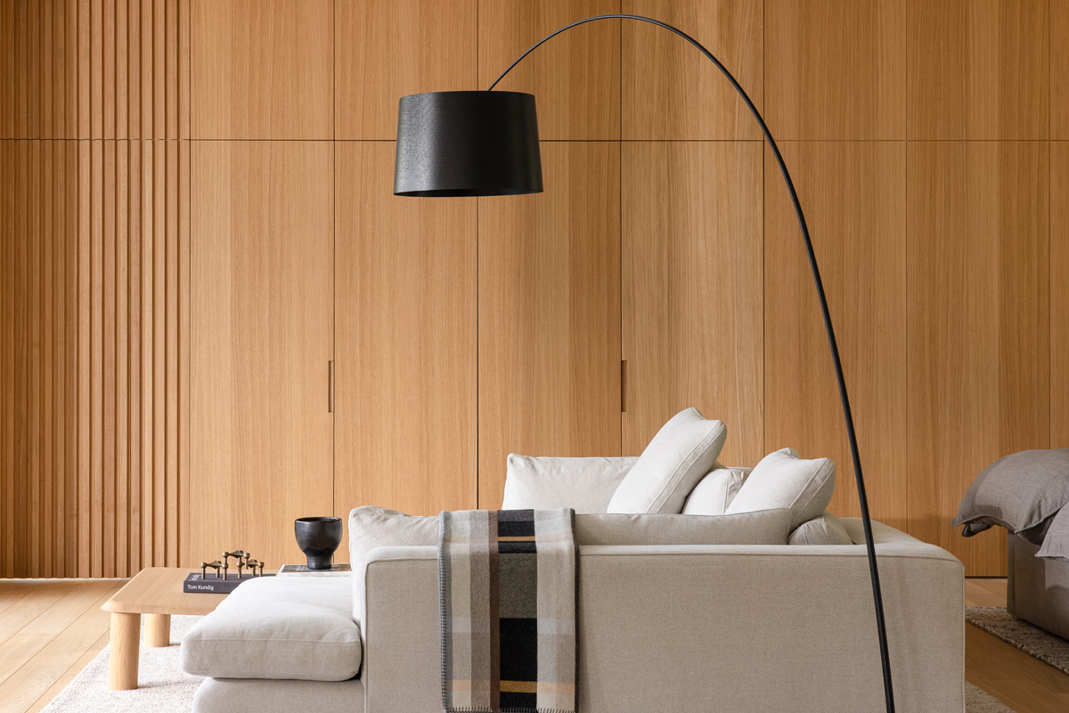 the living room at passive house forest retreat in pemberton, with oak wall panels